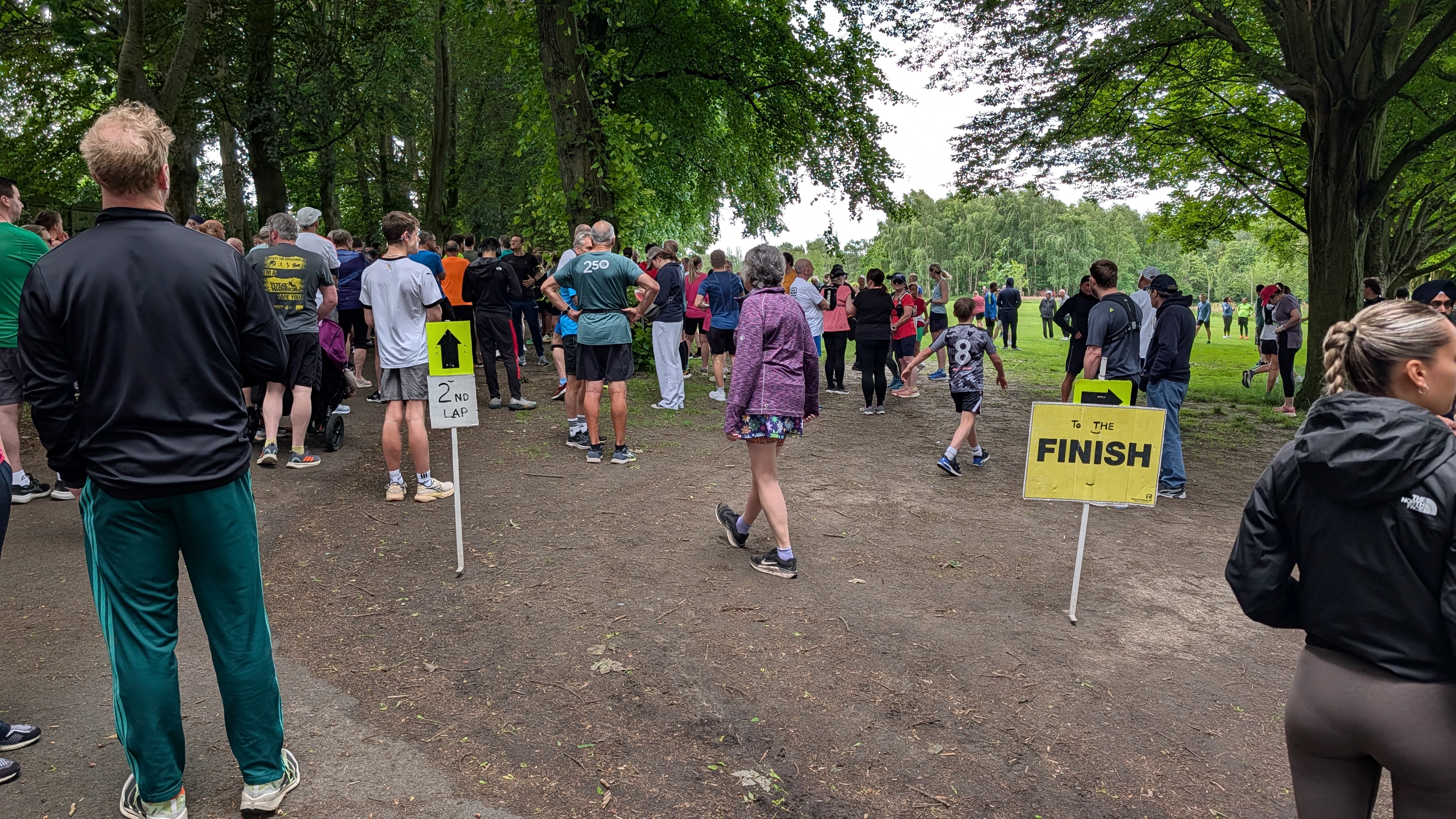 Lap split junction at Walsall Arboretum parkrun showing 2nd lap and finish signs
